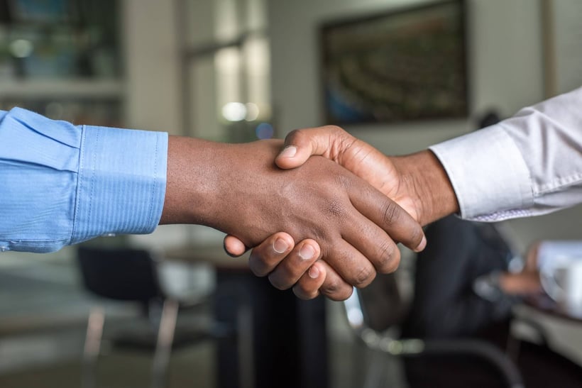 Cirrus Insight. Men shake hands to close deal.