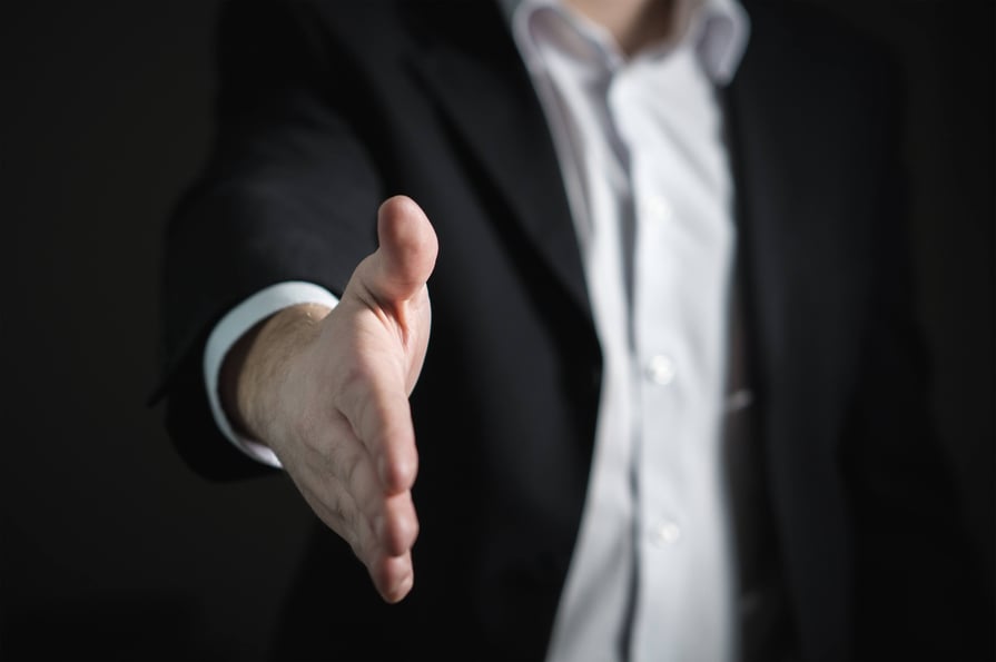 Cirrus Insight. Man extends hand for handshake.