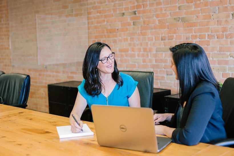 Cirrus Insight. Sales professionals working together at a large table.